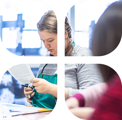 Opiskelutilanne, jossa nainen leikkaa paperia